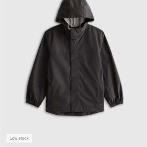 Quince Black Water Proof Hooded Rain Jacket - Size 12. Boys or Unisex